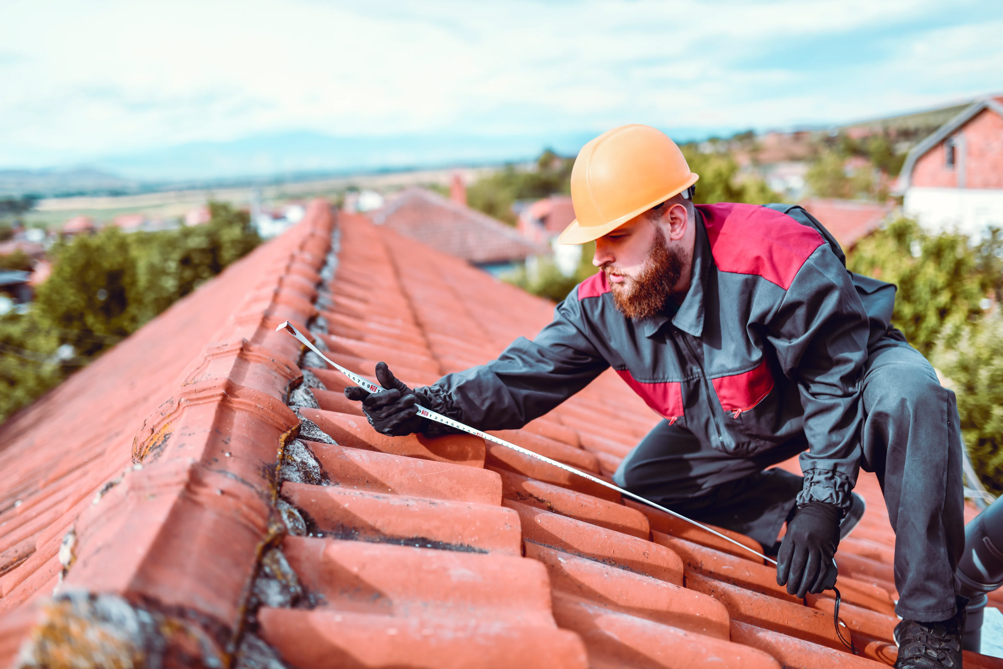 Worker maintaining roof in safety gear